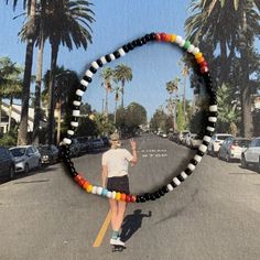 glass seed bead bracelet with black, white and rainbow pattern strung on elastic please gently roll off and on to prolong its life handmade in venice, ca Black And White Seed Bead Bracelet, Black Seed Bead Bracelet, Aesthetic Seed Bead Bracelets, Cool Beaded Bracelets, Seed Bead Bracelets Ideas, Small Bead Bracelets Ideas, Seed Bead Necklace Patterns, Seed Bead Bracelet Ideas, Glass Bead Bracelet Ideas