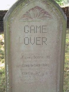 a headstone with the name game over written on it