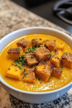 Creamy butternut squash soup topped with croutons and chopped herbs. Potato Soup