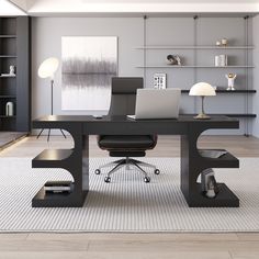 an office with a desk, chair and laptop on the rug in front of it