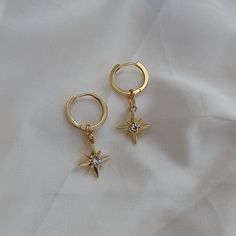 🖊️ Product details 🖊️ Handmade 18K Gold Plated Brass huggie earrings. Suitable for sensitive ears. Star charm: 12mm Huggie: 1.4cm in diameter Earring pin: 1mm 🫶 Product care 🫶 - To avoid your jewellery tarnishing from moisture and liquids, please refrain from wearing then in places such as pools and during intense exercise. - Keep your jewellery protected from the sun and safe from scratches and chips. It's best if you store your jewellery in air tight space. - Our jewellery are handmade with love, so please handle them carefully 😊 💌 Handling 💌 Please allow for 1-2 business days for your pieces to be made and packaged with care. Your order will be shipped in a padded envelope to ensure that your jewellery arrives safely. 💛 Thank you for choosing our store, we hope you love your goo Y2k Earrings, Cute Ear Piercings, Sleeper Earrings, Coin Earrings, Dangly Earrings, Huggie Earrings, Star Charms, Sensitive Ears, Pretty Jewellery