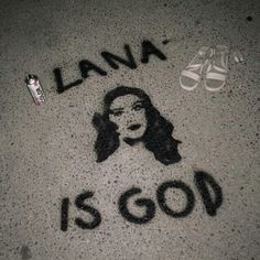 an image of lana is god written on the ground