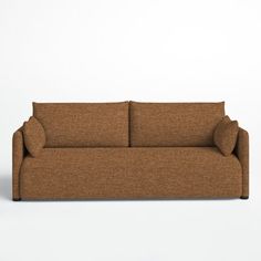 a brown couch sitting on top of a white floor