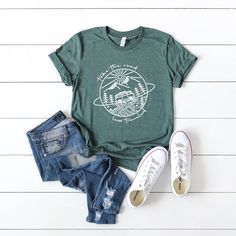 Looking for a cute versatile top to wear? Make sure to grab one of our Graphic tees! This soft and comfortable graphic tee is the perfect top for any outfit. It can be paiForest with biker shorts, jeans, or even a simple skirt/dress! This tee is true-to-size, so be sure to order your regular t-shirt size! If you are looking for a more oversized look, make sure to size up! Comfortable Green Top With Graphic Print, Green Graphic Print Top, Comfortable Crew Neck Top With Graphic Print, Comfortable Graphic Print Top, Simple Skirt, Sesame Street Characters, The Road Less Traveled, Road Less Traveled, Sleeping Under The Stars