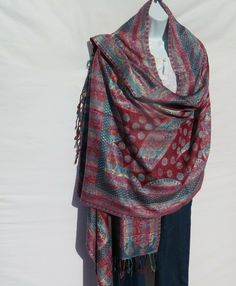 Unique One-Of-A-Kind Viscose Shawl/Wrap Handloomed/Handcrafted by Kashmiri Artisans Tribal Jamawar Patterns in the Shawl Design,  Handmade in Kashmir Tassels at Both Ends Tribal Design and Pattern !!!…Ideal Unique Handcrafted gift for you, family, your friends and co-workers…!!! Hand loomed in Tibet, Nepal or India each piece is handcrafted by a tribal family pattern.  _________________________________________________________ Viscose Viscose has a good reputation for being sustainable and environmentally friendly because it is made from plants [organic wood pulp] that is renewable. Its' origins go back to the late 19th century. The name “Viscose” comes from the manner in which the fiber is manufactured. A viscous organic liquid is used for the manufacturing of Viscose. Viscose fabric is du Shawl Design, Organic Wood, Flood Light, Shawl Wrap, Hand Crafted Gifts, Viscose Fabric, Hand Loom, Red Light, Light Red