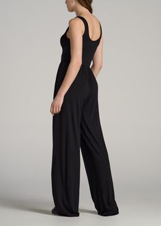 The Tall Woman's Dream Jumpsuit Elegance and Ease in One Piece Discover the Jersey Tank Wide Leg Women's Tall Jumpsuit – a single piece that makes a complete outfit. Designed for the tall, modern woman, this jumpsuit is a fusion of comfort and fashion with its soft tencel-spandex blend and a flowy wide-leg design. The full-length, sleeveless design, complemented by side seam pockets, offers both convenience and style. Whether you're stepping out for a casual day or dressing up for an evening eve Black Sleeveless Elastane Jumpsuits And Rompers, Sleeveless Elastane Bodysuit For Evening, Sleeveless Bodysuit For Evening, Elegant Black One-piece Jumpsuit, Formal Sleeveless Elastane Jumpsuits And Rompers, Black One-piece Jumpsuits For Evening, Black Evening Jumpsuits And Rompers, Elegant Black Strapless Jumpsuit With V-neck, Elegant Black Strapless V-neck Jumpsuit