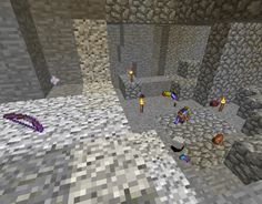 an image of some people playing in a minecraft environment with rocks and stones on the ground