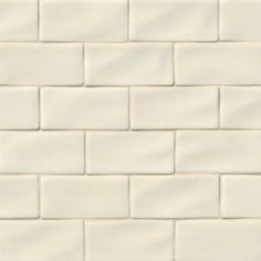 a white brick wall that is very close up to the ground with no people in it