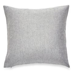 a light gray pillow on a white background