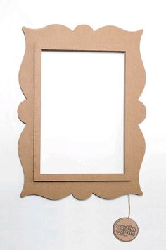 a wooden frame hanging on the wall next to a tag with an inscription that says happy birthday