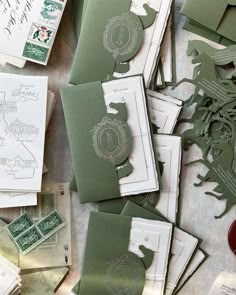 many different green and white cards on a table