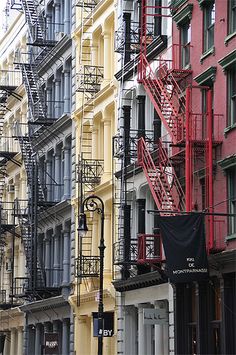 several buildings with fire escapes on the side