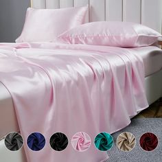 the bed is covered with pink sheets and pillows, along with four different color options