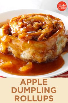 an apple dumpling rolls on a plate with caramel sauce