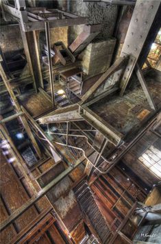 an old building with lots of windows and metal bars on the bottom floor, as seen from above