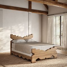 a bed that is made up and sitting on a rug in a room with wooden beams