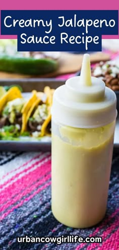 creamy jalapeno sauce recipe in a small bottle on a colorful tablecloth