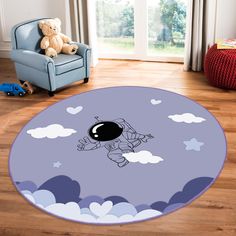 a child's room with a blue chair, teddy bear and an astronaut rug