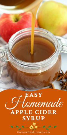 an apple cider syrup being poured into a jar