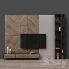 an empty living room with a television on the wall