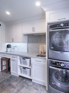 a washer and dryer sitting in a kitchen next to each other