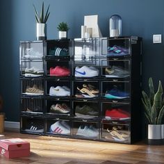 a black shelf filled with lots of shoes