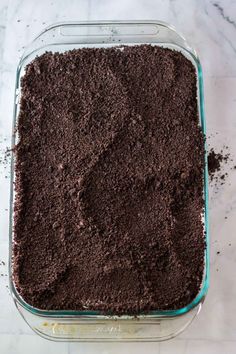 a glass baking dish filled with chocolate cake mix