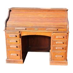 an old fashioned wooden desk with drawers