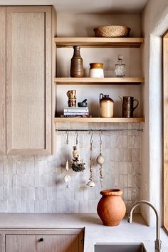 an instagram page showing the kitchen's white tile backsplash