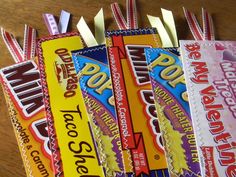 four candy bars are lined up on a table