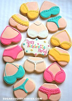 decorated cookies are arranged in the shape of bikinis