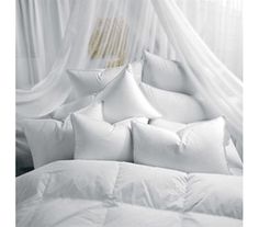 white pillows piled on top of each other