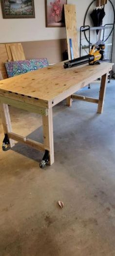 a workbench in a garage with tools on the table and bench behind it