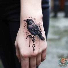 a black bird on the left hand with dripping paint all over it's body