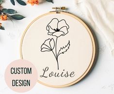 the embroidery pattern has been made to look like an embroidered flower with words that read, custom