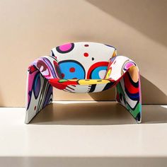 a colorful chair sitting on top of a white counter