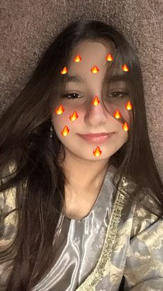 a girl with orange lights on her face