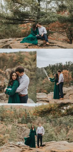 an engaged couple holding each other while standing on top of a mountain