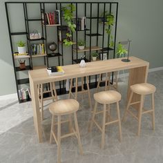 a table with four stools in front of it and bookshelves behind it