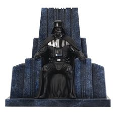 a statue of darth vader sitting on a throne