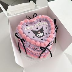 a heart shaped birthday cake in a box