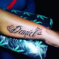 a person with a tattoo on their arm that says dance