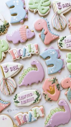 some decorated cookies are laying on a table