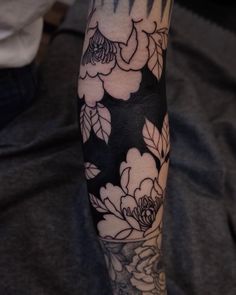 a person with a flower tattoo on their arm