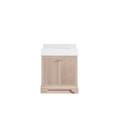 a white sink sitting next to a wooden cabinet