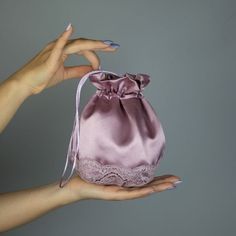 A very elegant satin taft bag for your wedding party or evening dress. Made of luxury satin taft. Color: mauve Bag is approx. 18 x 18 cm , ideal to keep a lipstick, telephone etc. WE have matching wraps in our Etsy Shop! WE accept credit cards! Handmade Purple Evening Bag For Party, Satin Pouch Evening Bag For Parties, Purple Evening Bag For Wedding, Elegant Lavender Formal Bag, Elegant Bag With Satin Lining As Gift, Elegant Bag With Satin Lining For Gift, Elegant Satin Pouch Evening Bag, Elegant Satin Evening Bag With Satin Finish, Elegant Gift Bag With Satin Lining