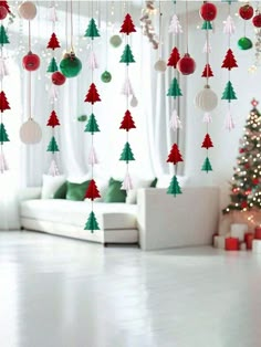 a living room with christmas decorations hanging from the ceiling