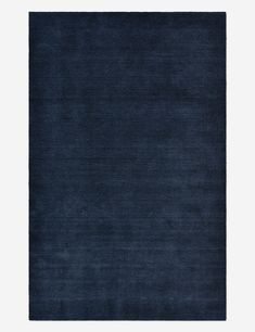 a dark blue rug on a white background