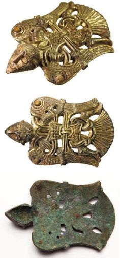 three pieces of metal that have been made to look like fish