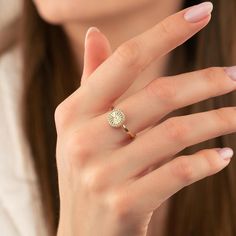 a woman's hand with a ring on it